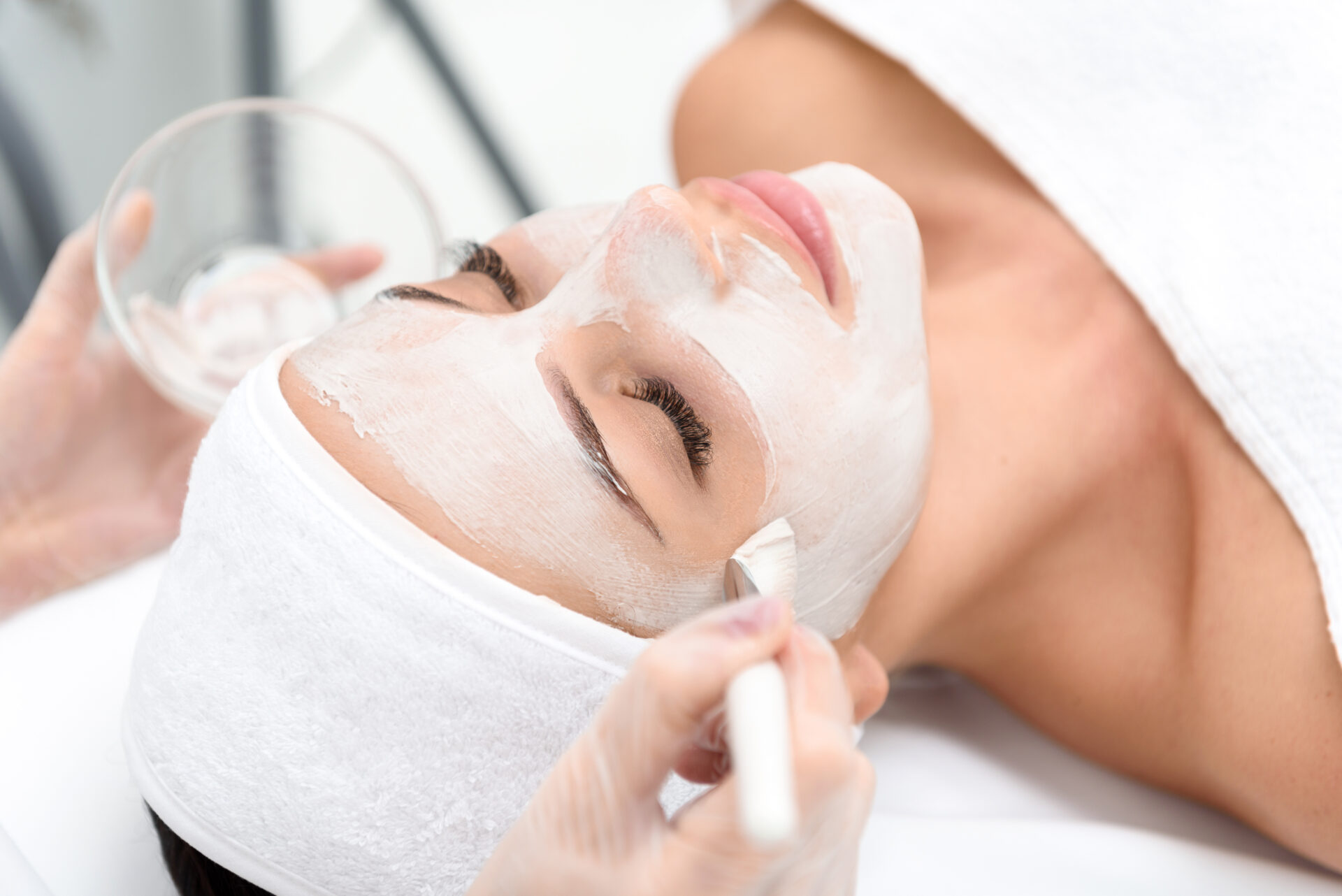 Relaxed young woman enjoying spa procedure Relaxed young woman enjoying spa procedure